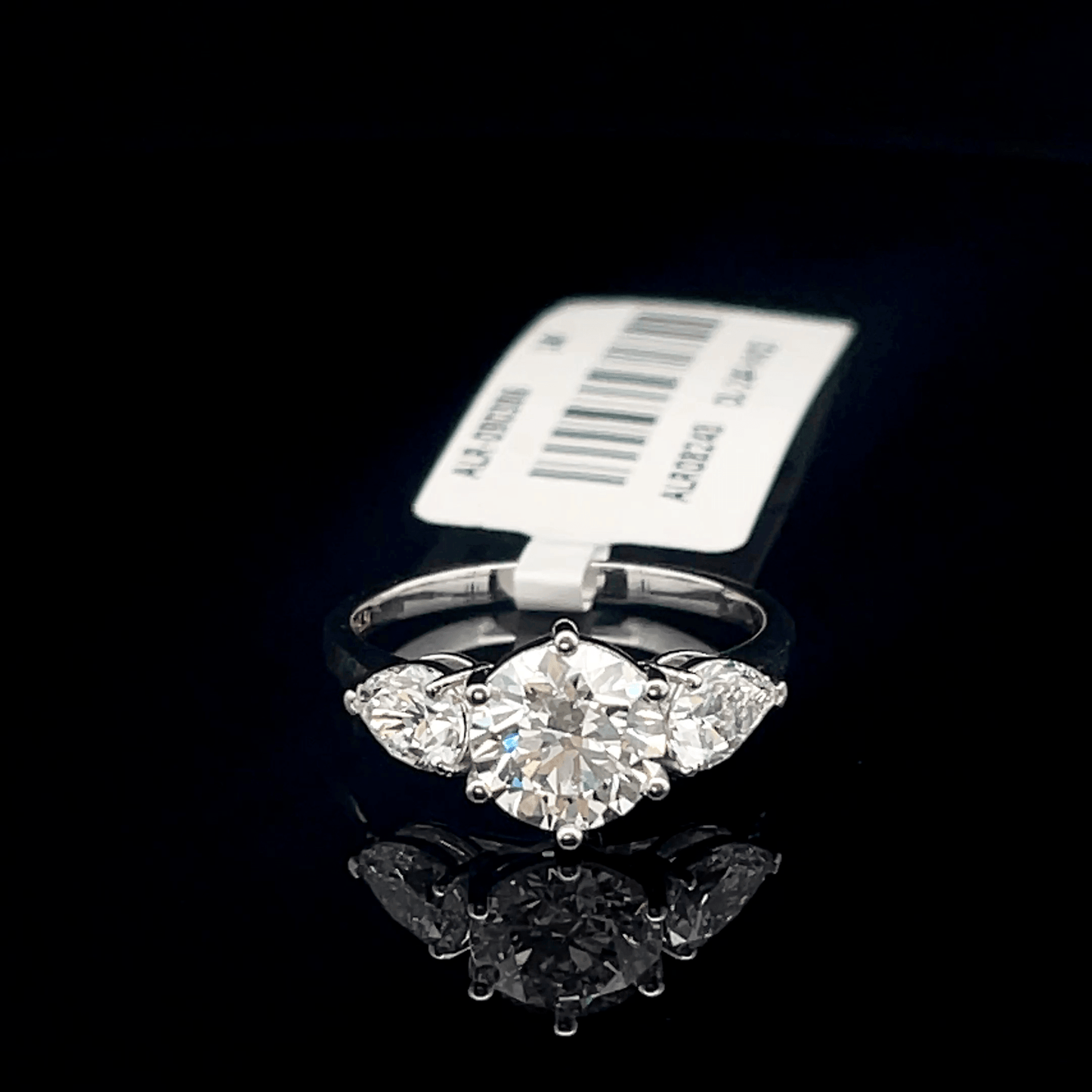 Round and Pear Three Stone Diamond Ring