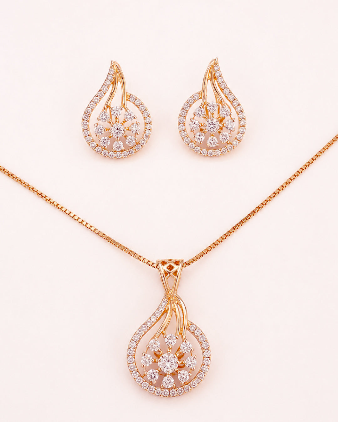Elegant teardrop pendant with matching stud earrings