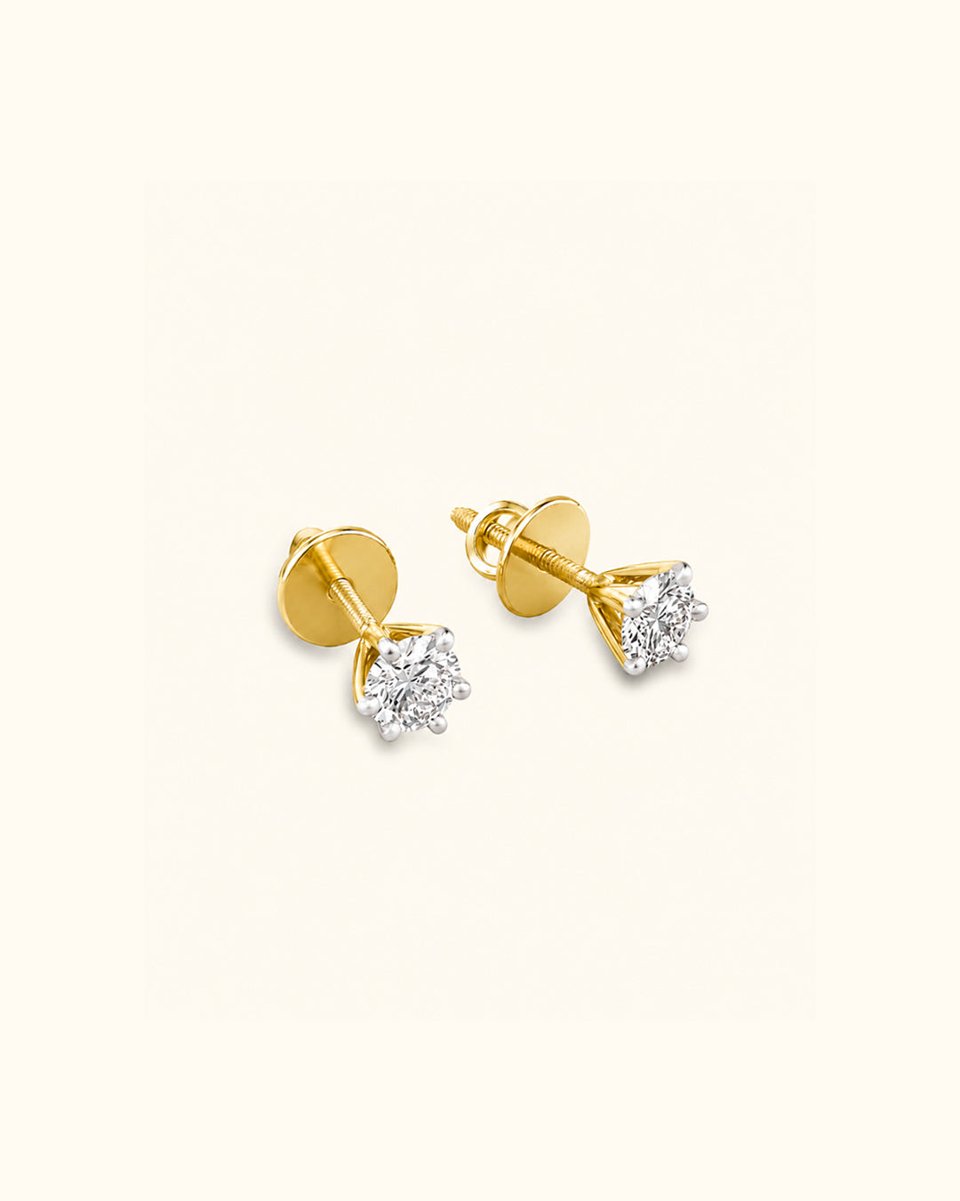 0.705 Carat each solitaire studs