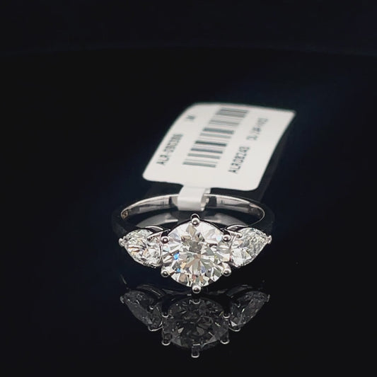 Round and Pear Three Stone Diamond Ring